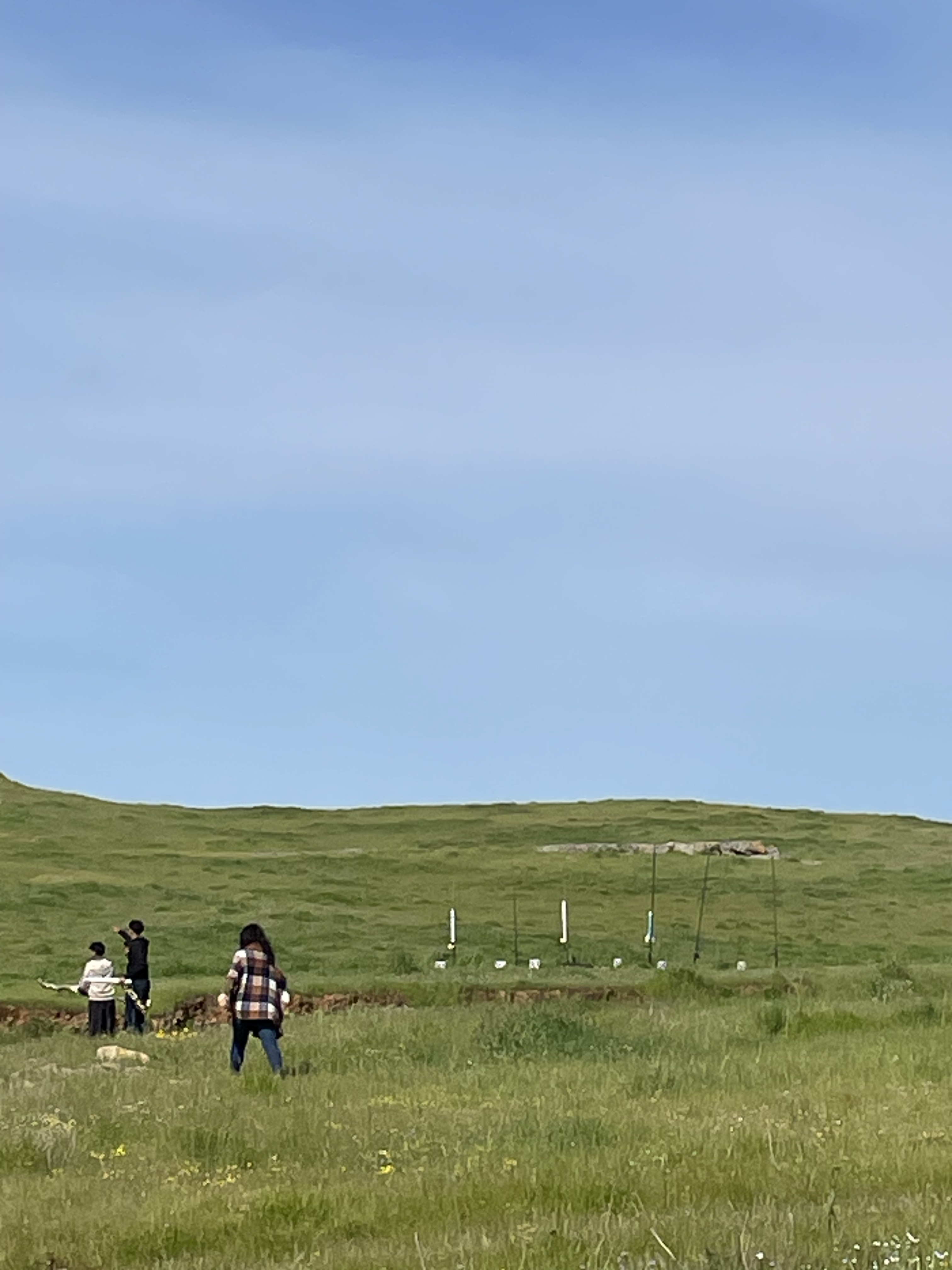 Team members preparing launch equipment in field